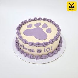 Big pawprint pet birthday cake in purple